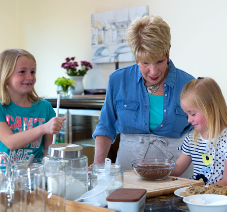 Woman baking with her grandkids